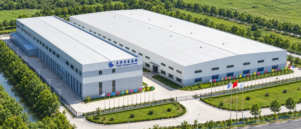 Factory building surrounded by landscaped grounds